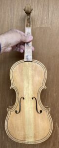 Five String fiddle with sealer applied.