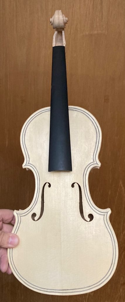 Front view white five string fiddle by Chet Bishop. Luthier